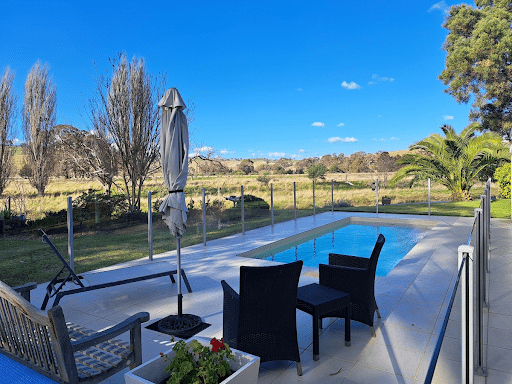 Residential swimming pool in Victoria covered for winter with pool equipment stored and secured
